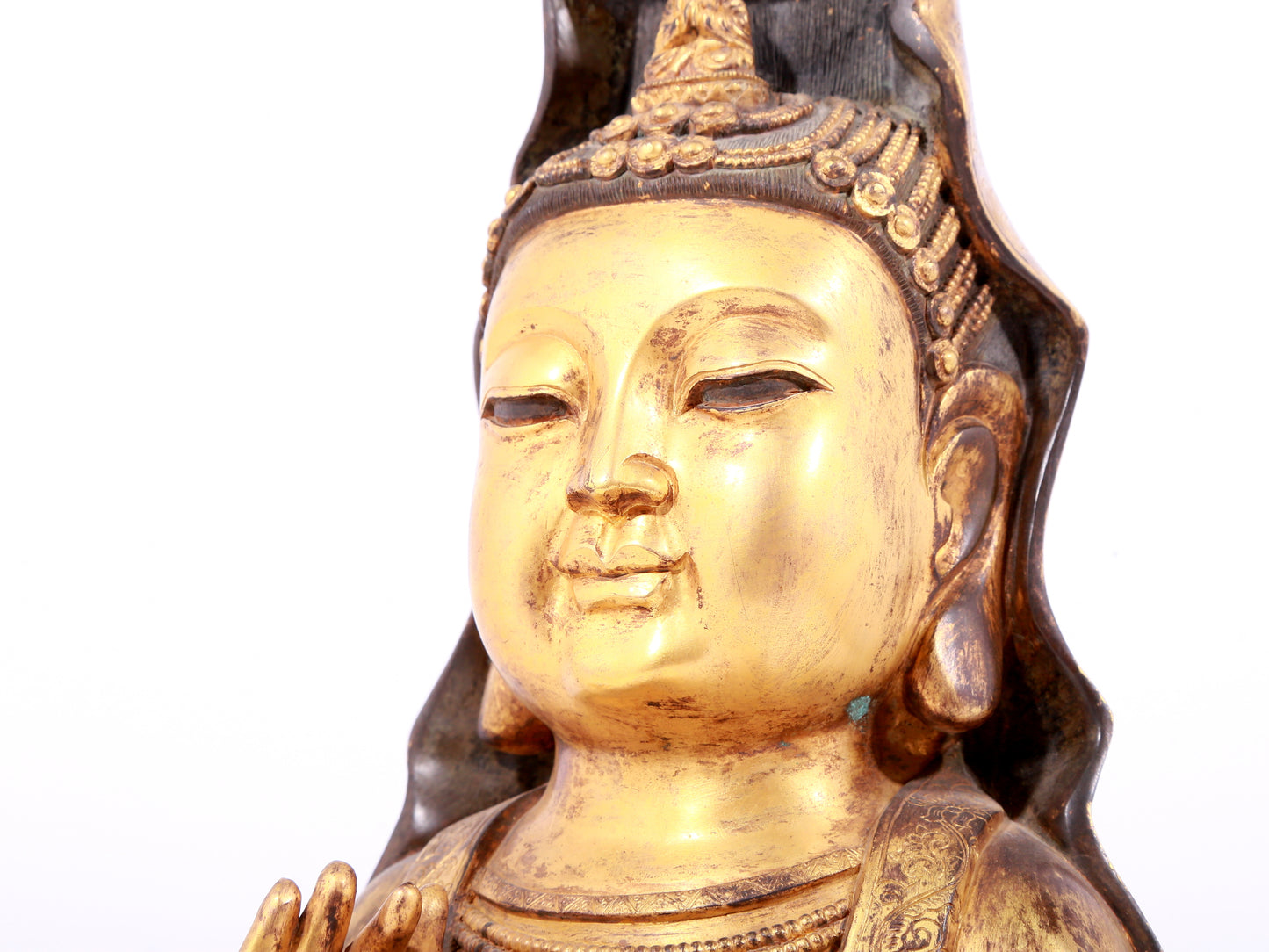 A solemn gilt bronze statue of Guanyin