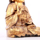 A solemn gilt bronze statue of Guanyin