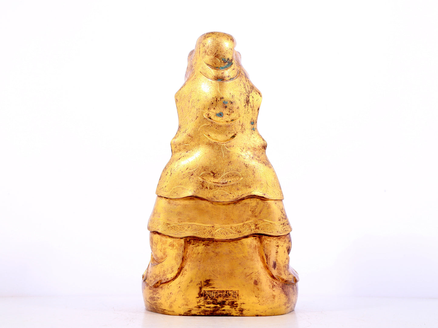 A solemn gilt bronze statue of Guanyin