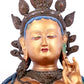 A solemn gilt bronze statue of green Tara