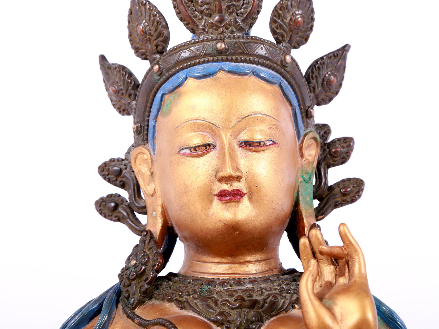 A solemn gilt bronze statue of green Tara