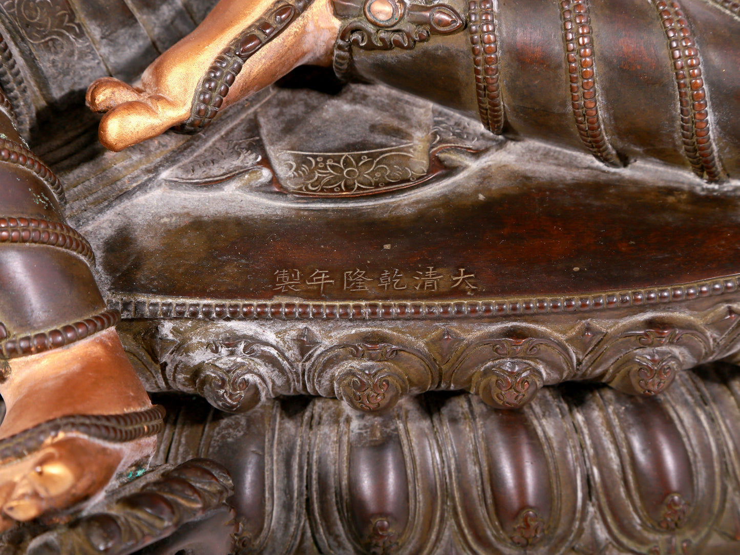 A solemn gilt bronze statue of green Tara