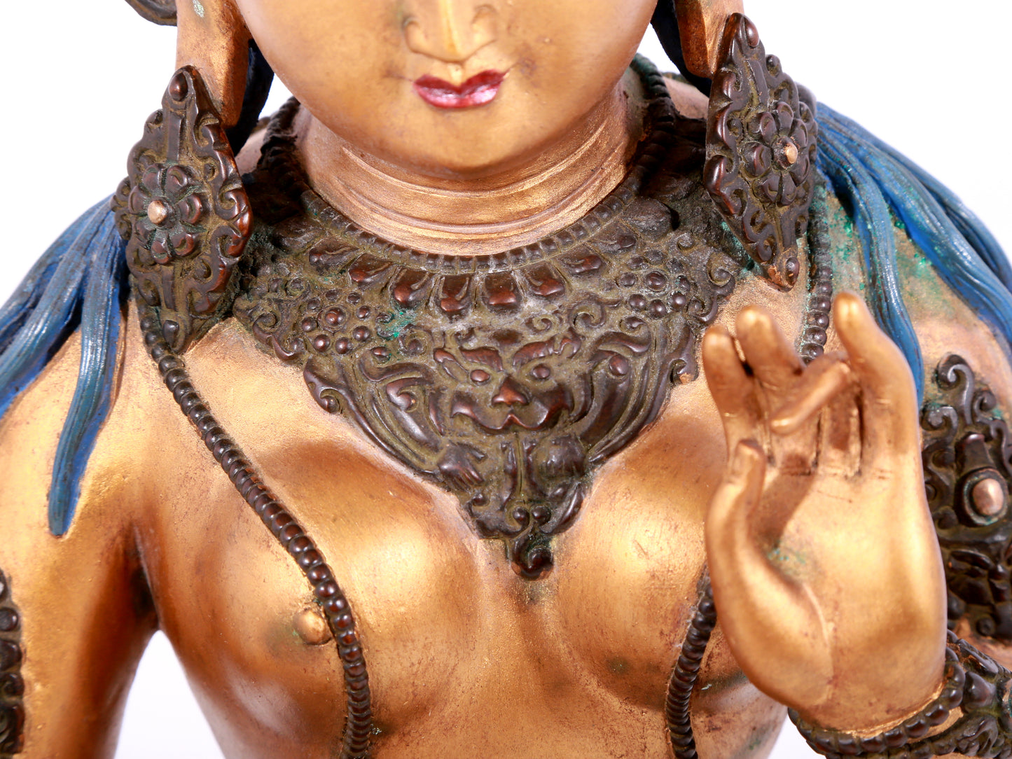 A solemn gilt bronze statue of green Tara