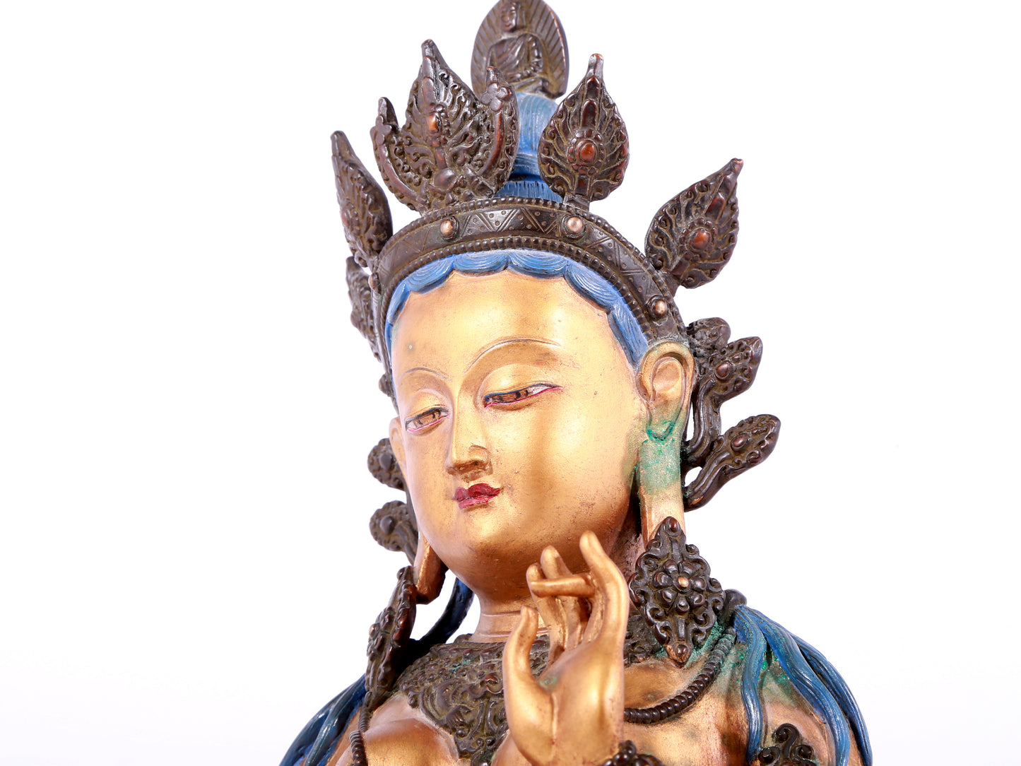 A solemn gilt bronze statue of green Tara