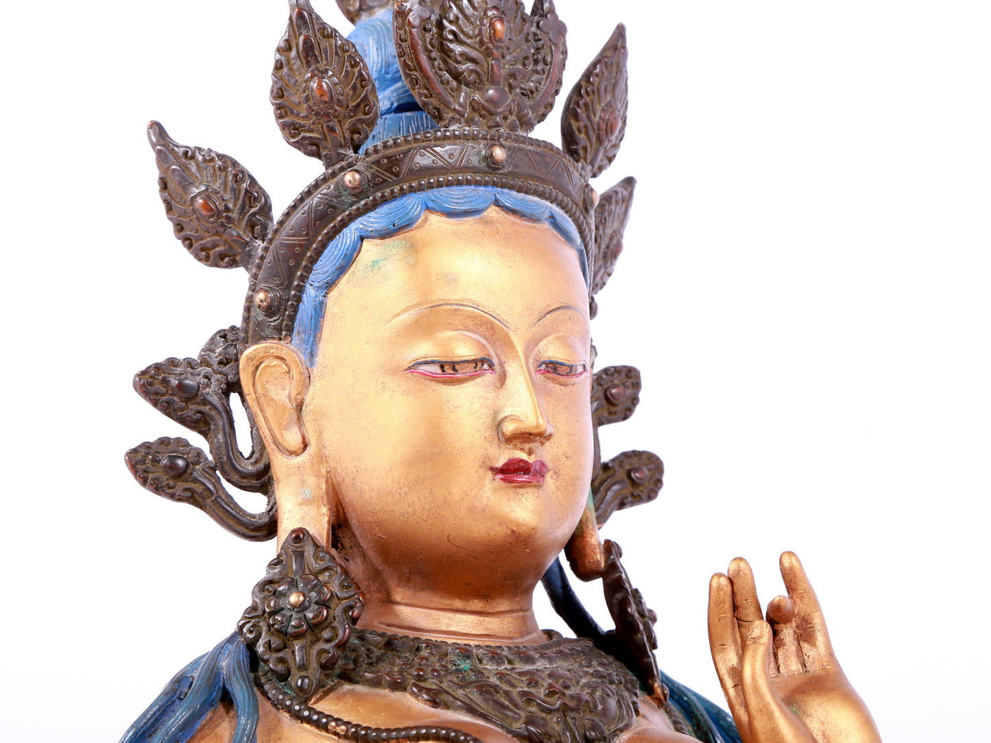 A solemn gilt bronze statue of green Tara