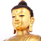 A solemn gilt bronze statue of Sakyamuni