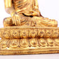 A solemn gilt bronze statue of Sakyamuni