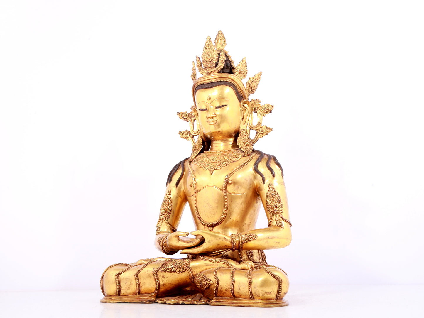 A solemn gilt bronze statue of Bodhisattva