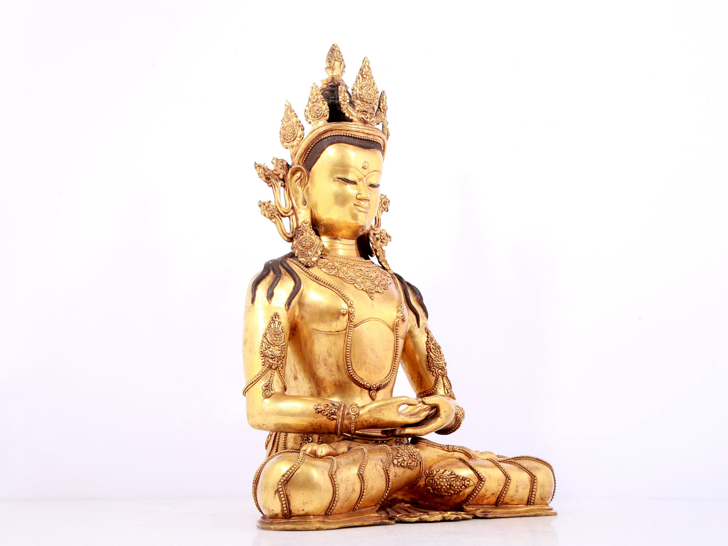 A solemn gilt bronze statue of Bodhisattva