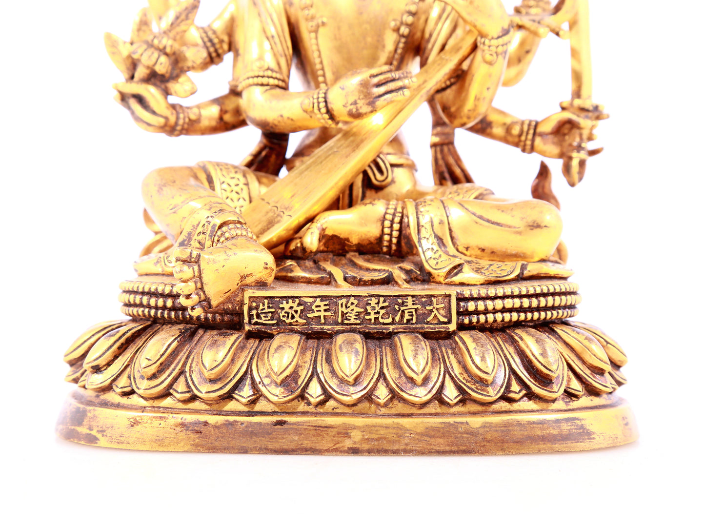 A solemn gilt bronze statue of Mystical Sound Buddha