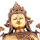 A solemn gilt bronze statue of green Tara