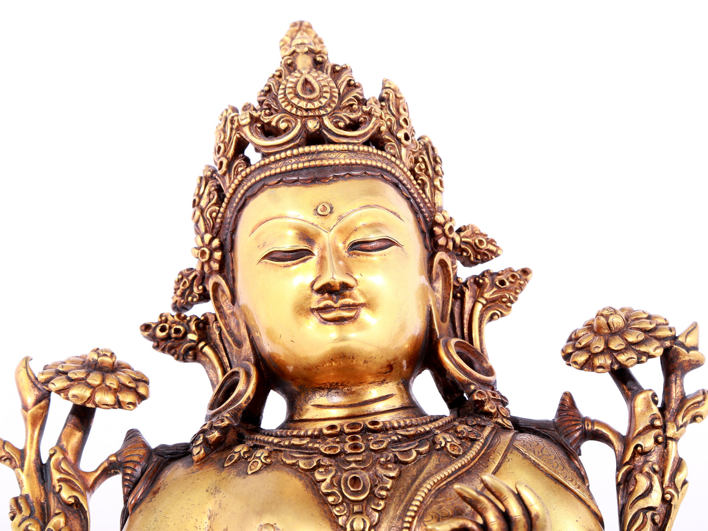 A solemn gilt bronze statue of green Tara