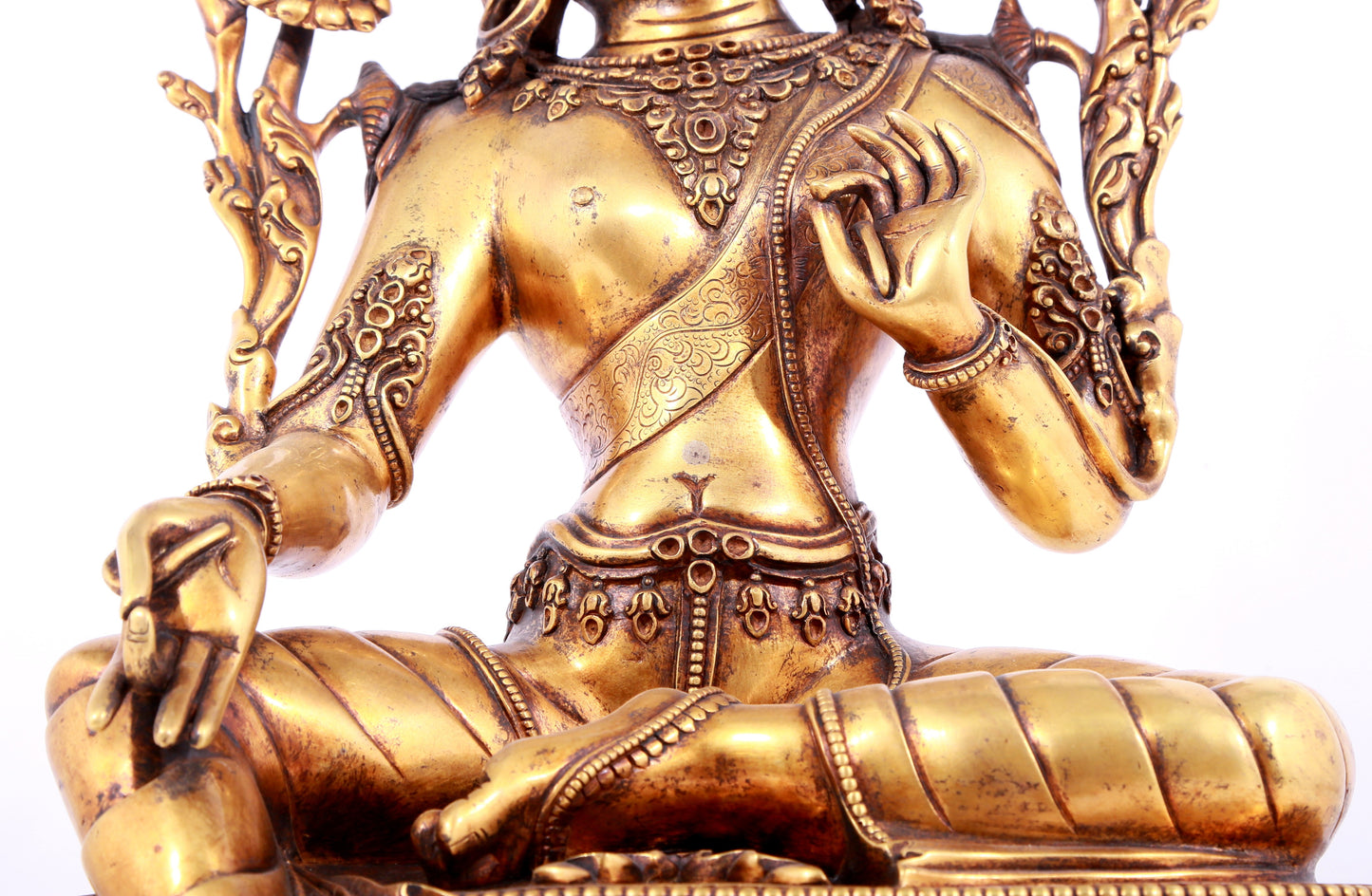 A solemn gilt bronze statue of green Tara