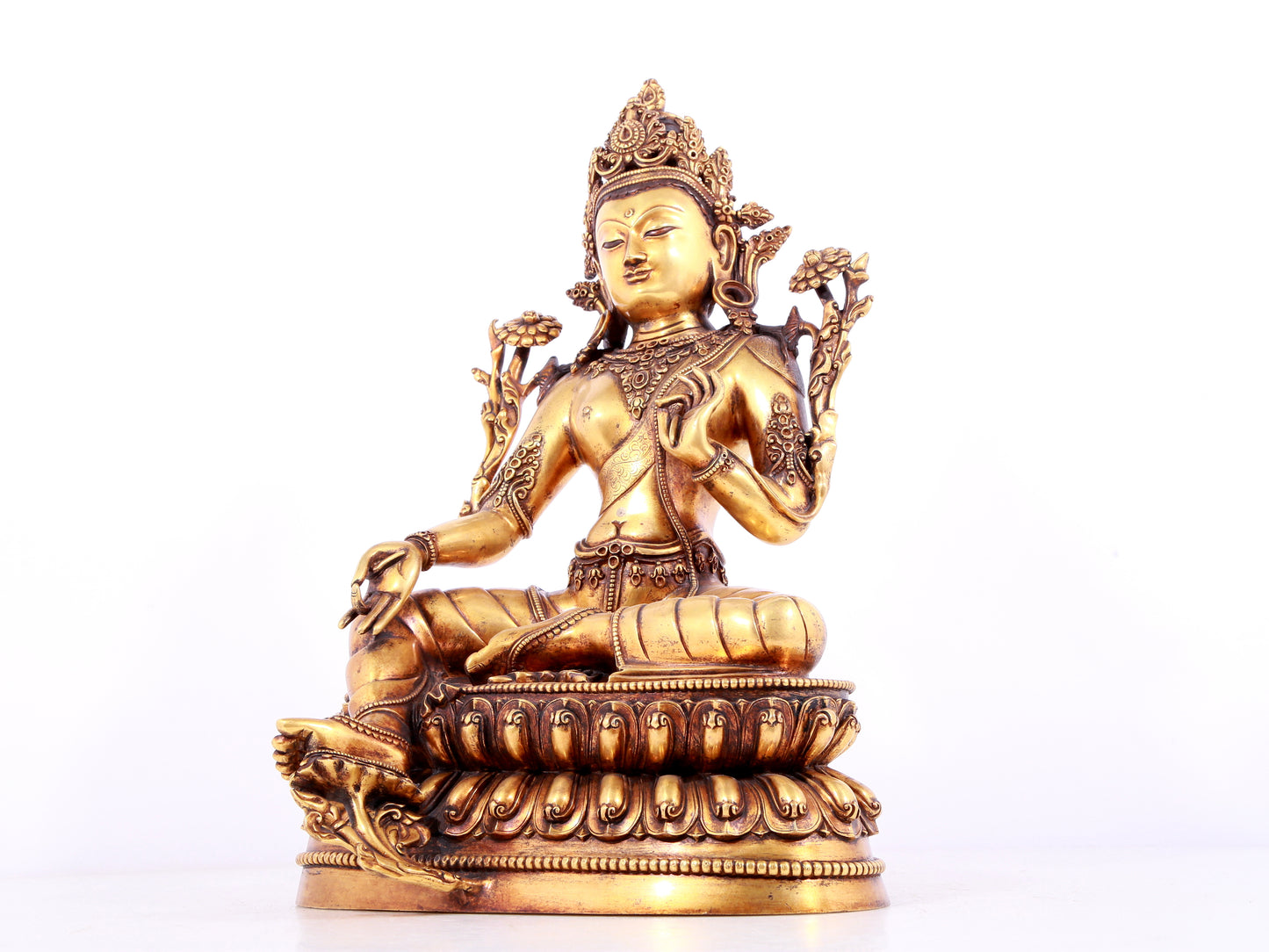 A solemn gilt bronze statue of green Tara