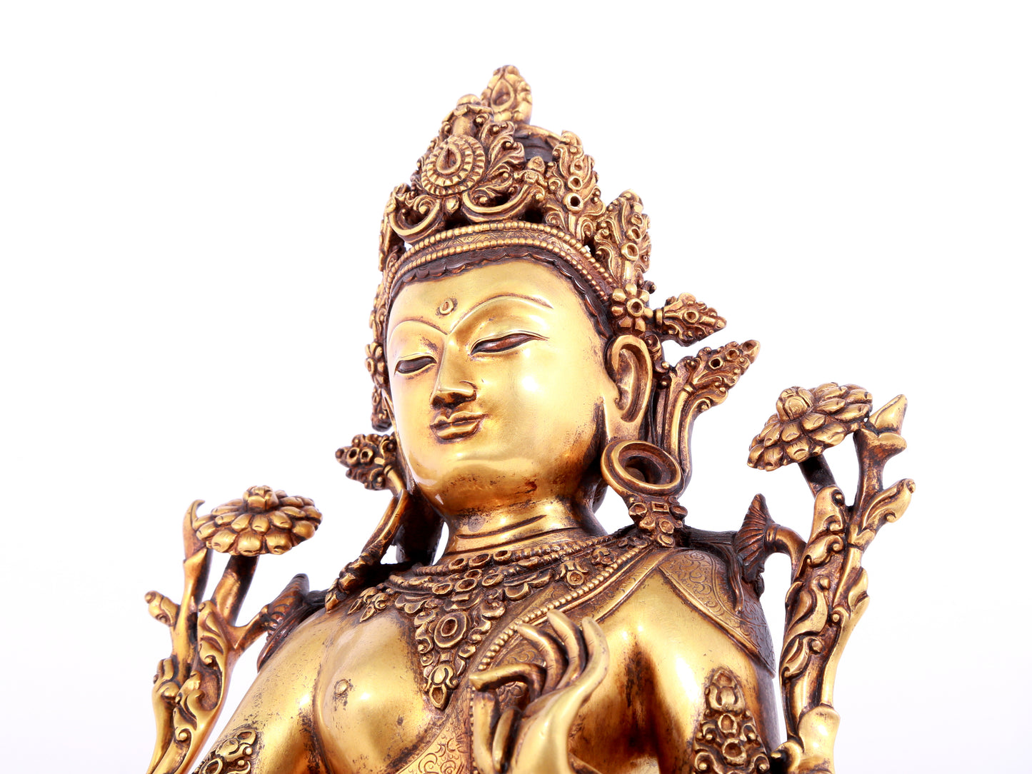 A solemn gilt bronze statue of green Tara