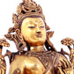 A solemn gilt bronze statue of green Tara