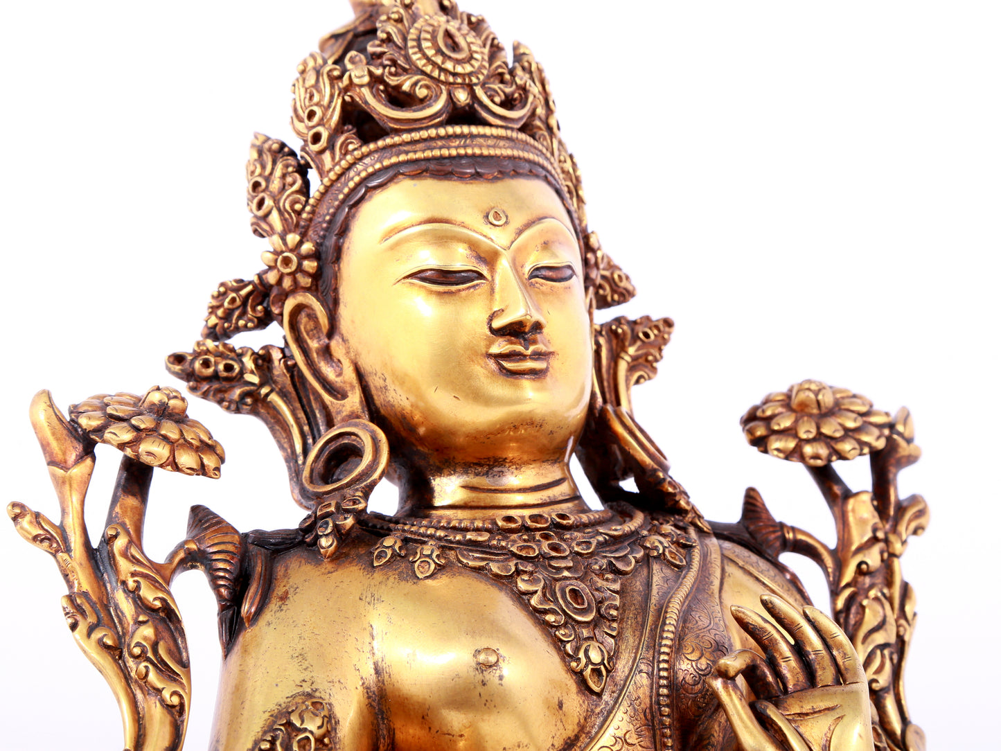 A solemn gilt bronze statue of green Tara