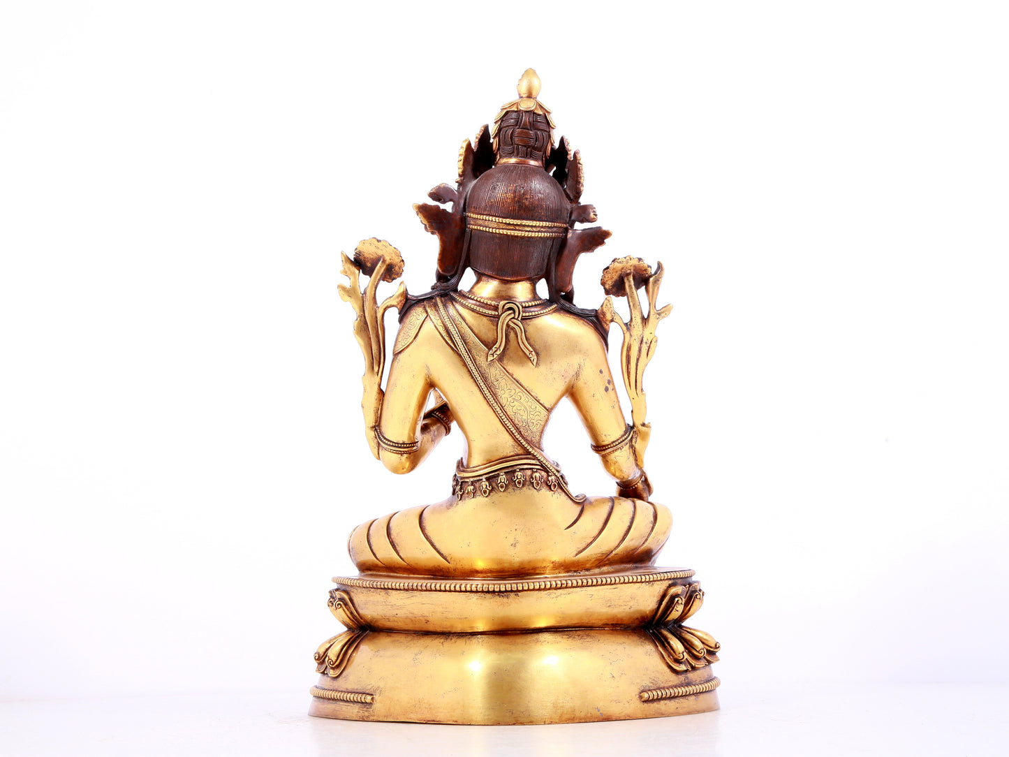 A solemn gilt bronze statue of green Tara