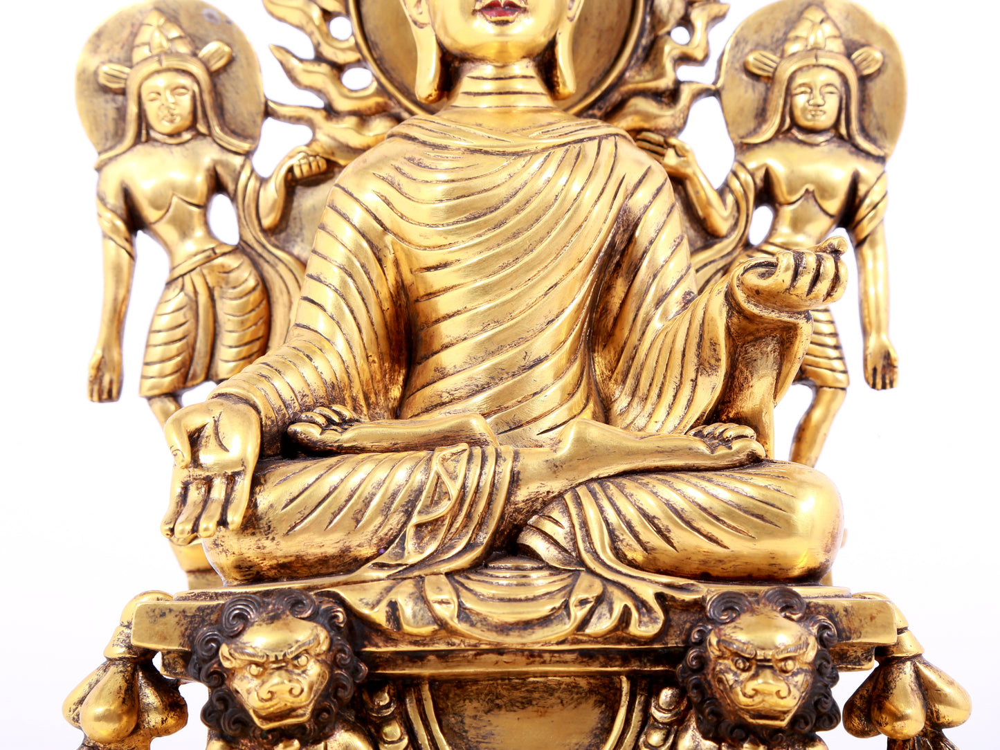 A solemn gilt bronze statue of Sakyamuni