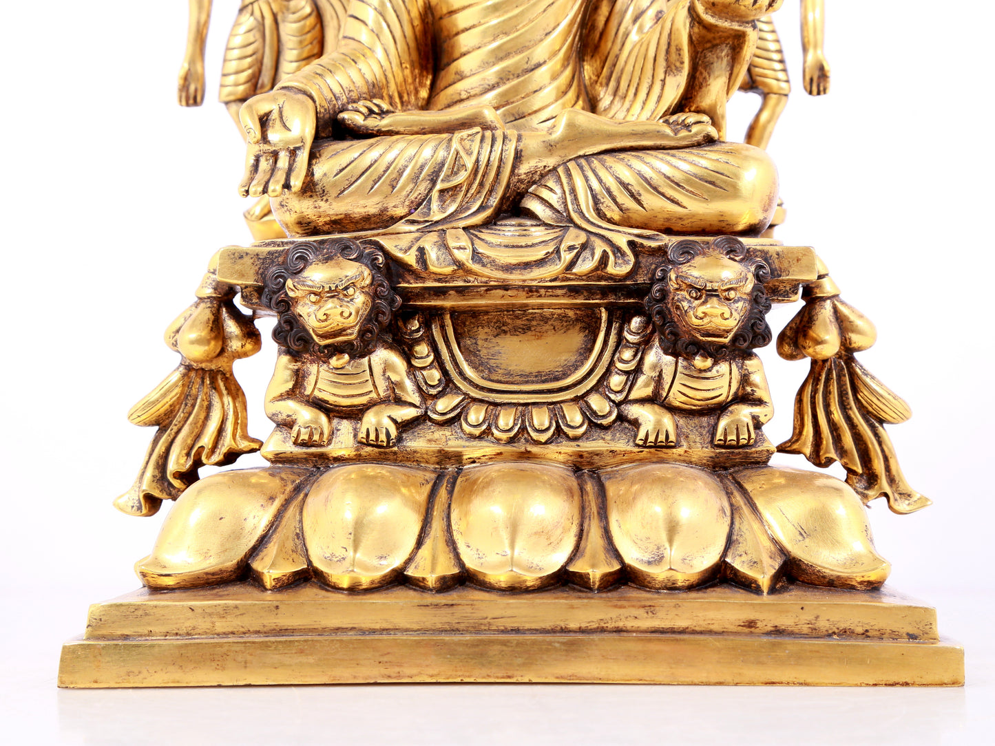 A solemn gilt bronze statue of Sakyamuni