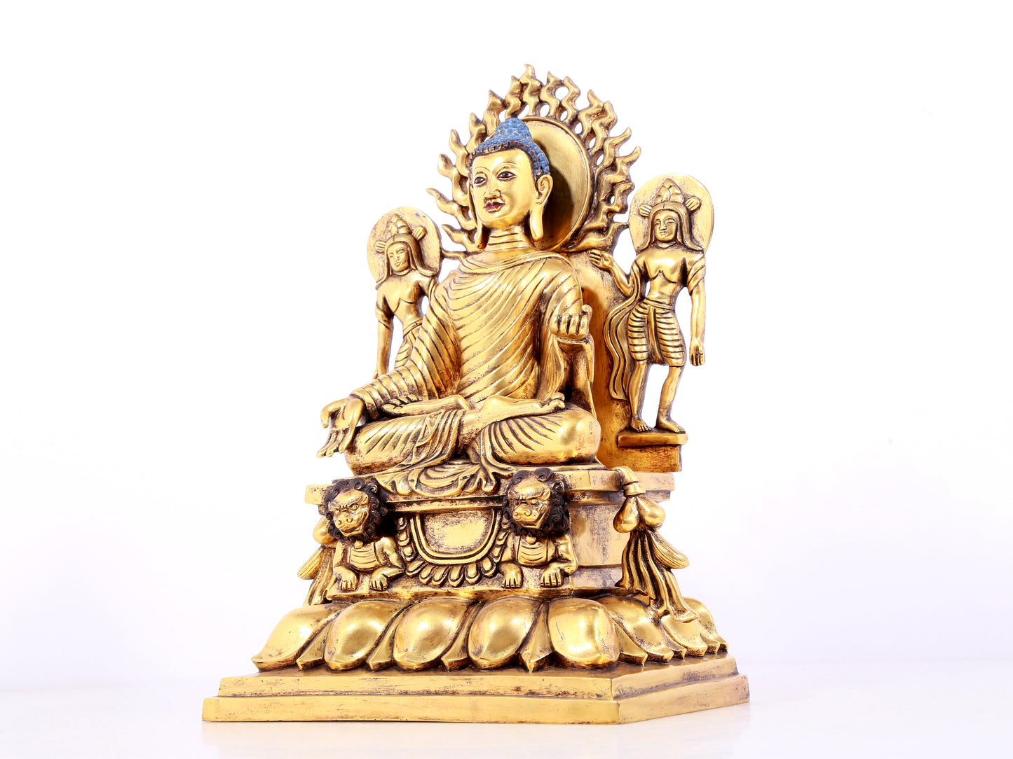 A solemn gilt bronze statue of Sakyamuni