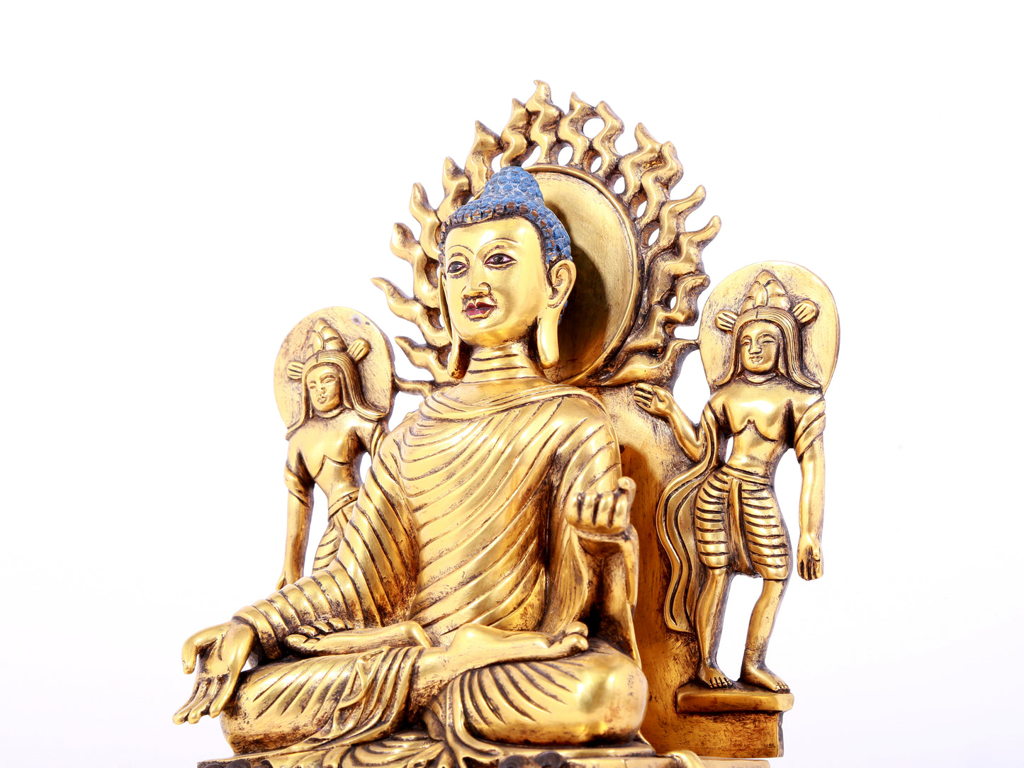 A solemn gilt bronze statue of Sakyamuni