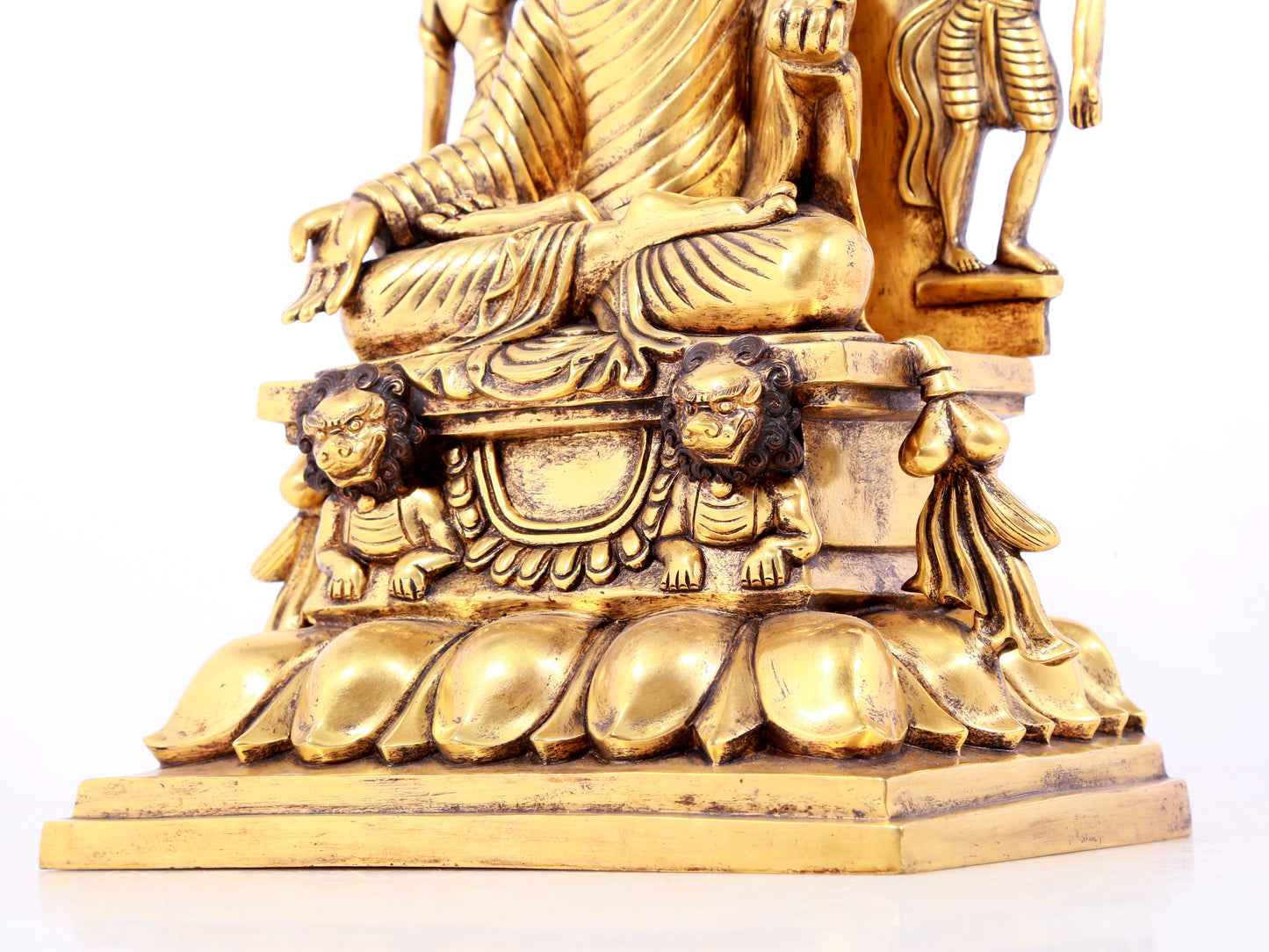 A solemn gilt bronze statue of Sakyamuni