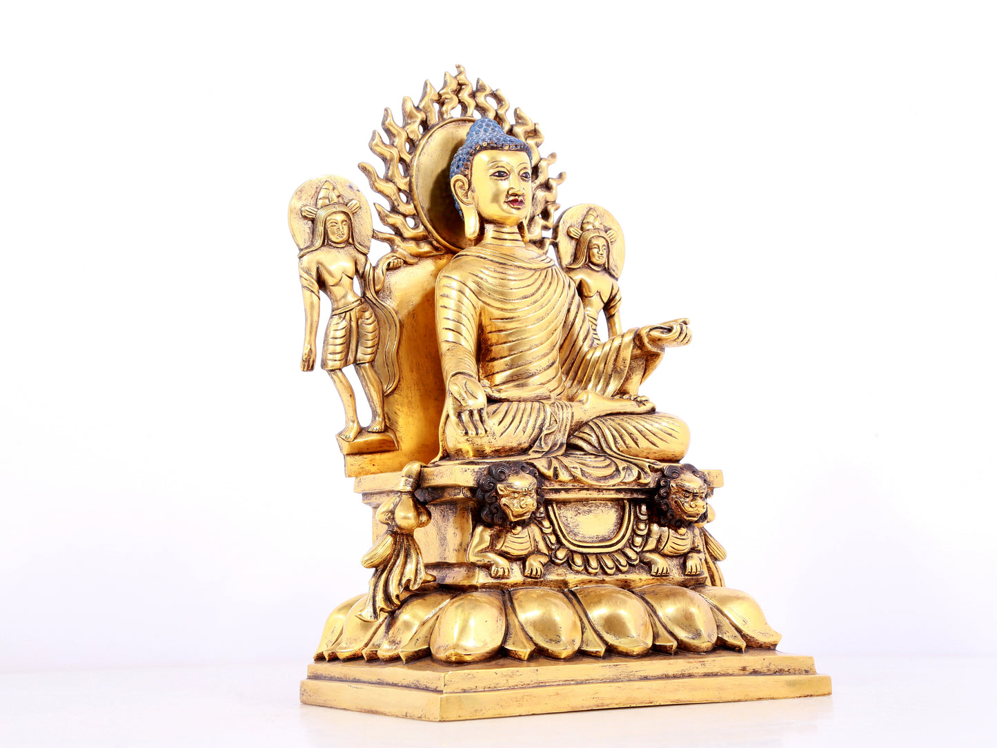 A solemn gilt bronze statue of Sakyamuni