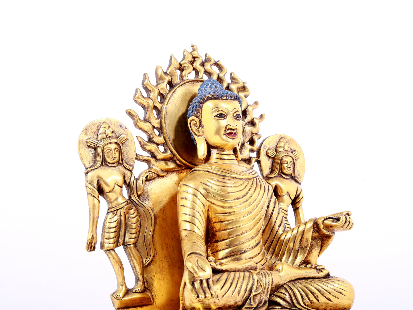 A solemn gilt bronze statue of Sakyamuni