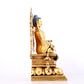 A solemn gilt bronze statue of Sakyamuni