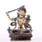 A solemn gilt bronze statue of Manjushri Bodhisattva