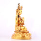 A solemn gilt bronze statue of Guanyin with four arms inlaid gems