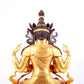 A solemn gilt bronze statue of Guanyin with four arms inlaid gems