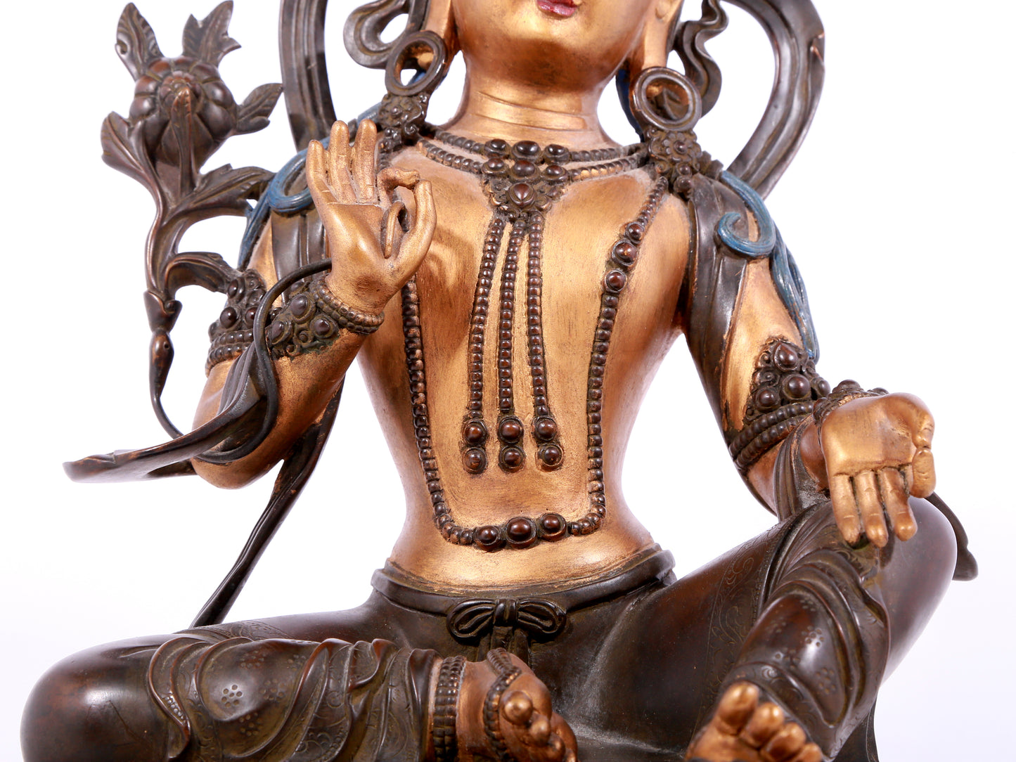 A solemn gilt bronze statue of green Tara