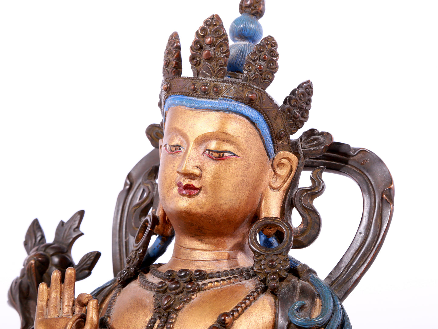 A solemn gilt bronze statue of green Tara