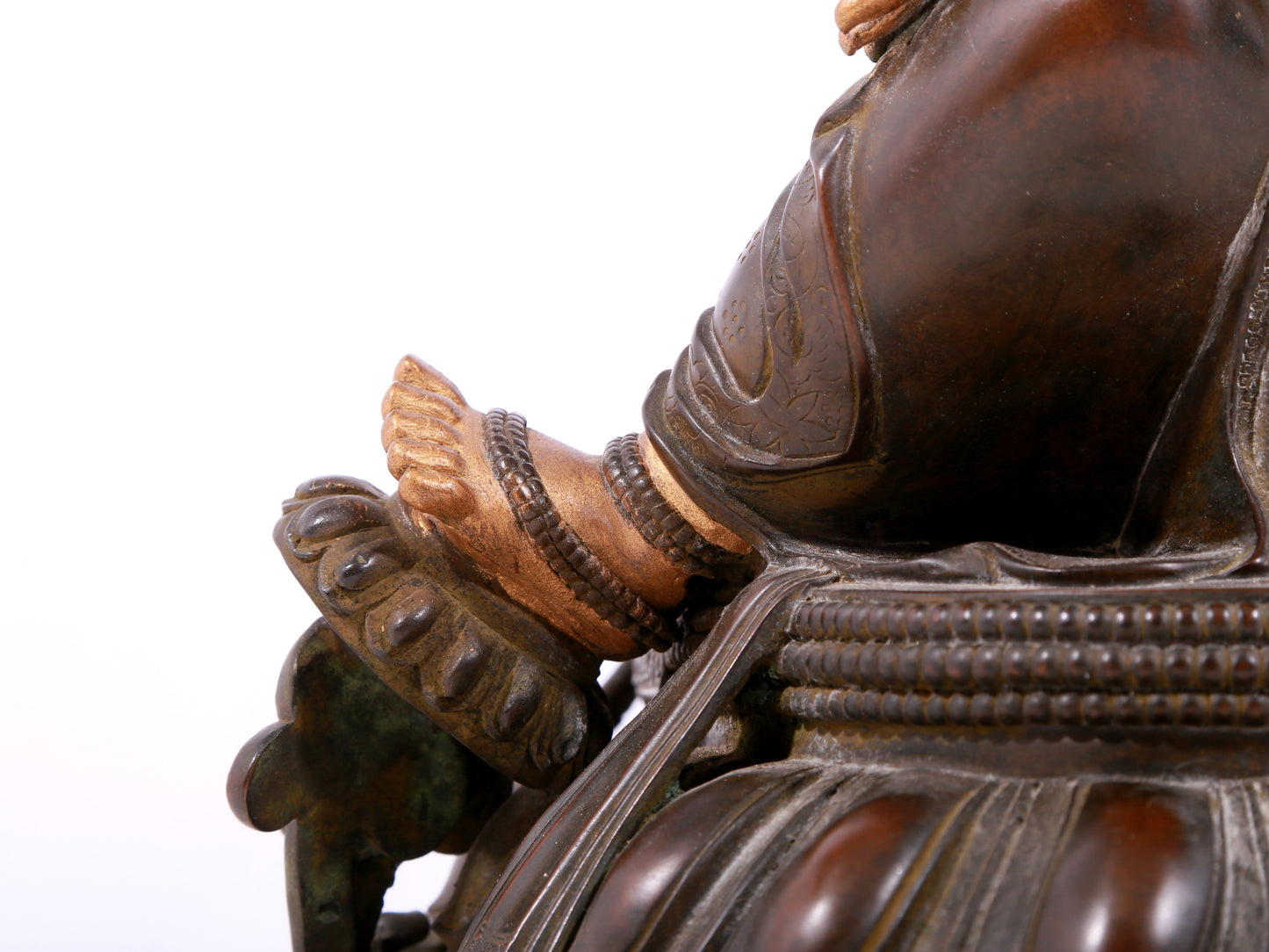 A solemn gilt bronze statue of green Tara