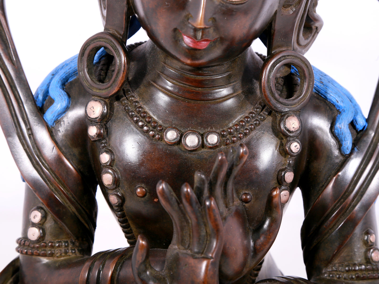 A solemn bronze Buddha statue