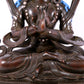 A solemn bronze Buddha statue