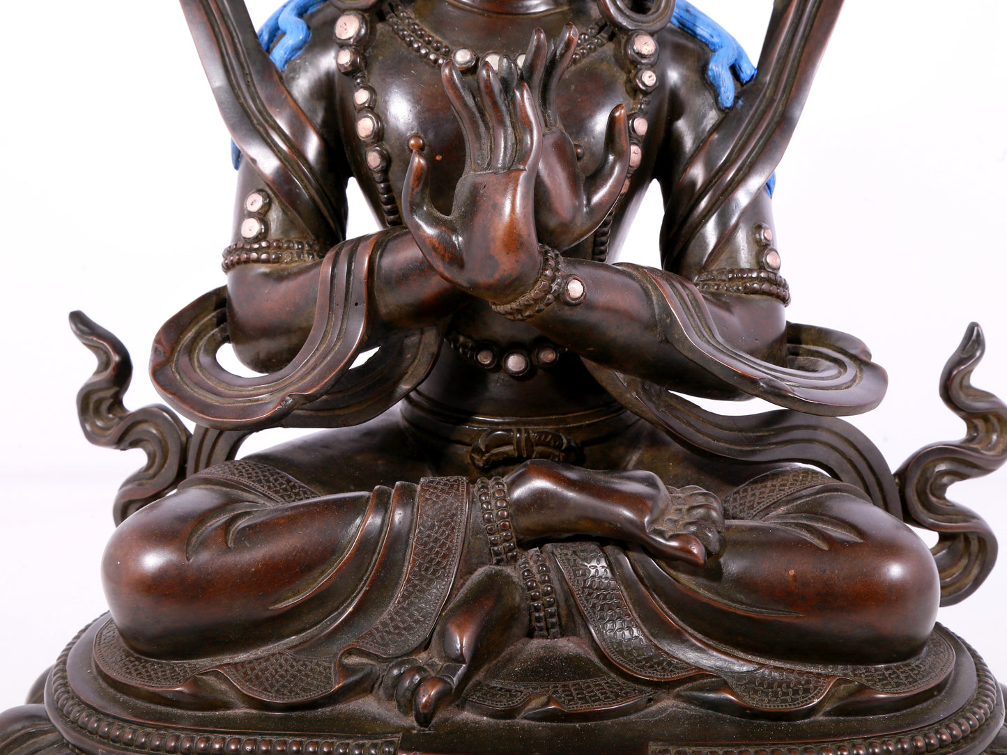 A solemn bronze Buddha statue