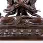 A solemn bronze Buddha statue