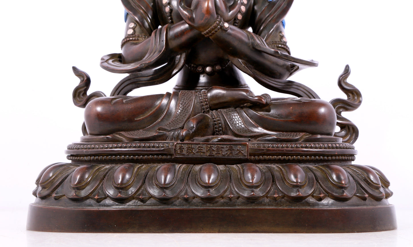 A solemn bronze Buddha statue