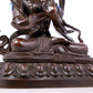 A solemn bronze Buddha statue