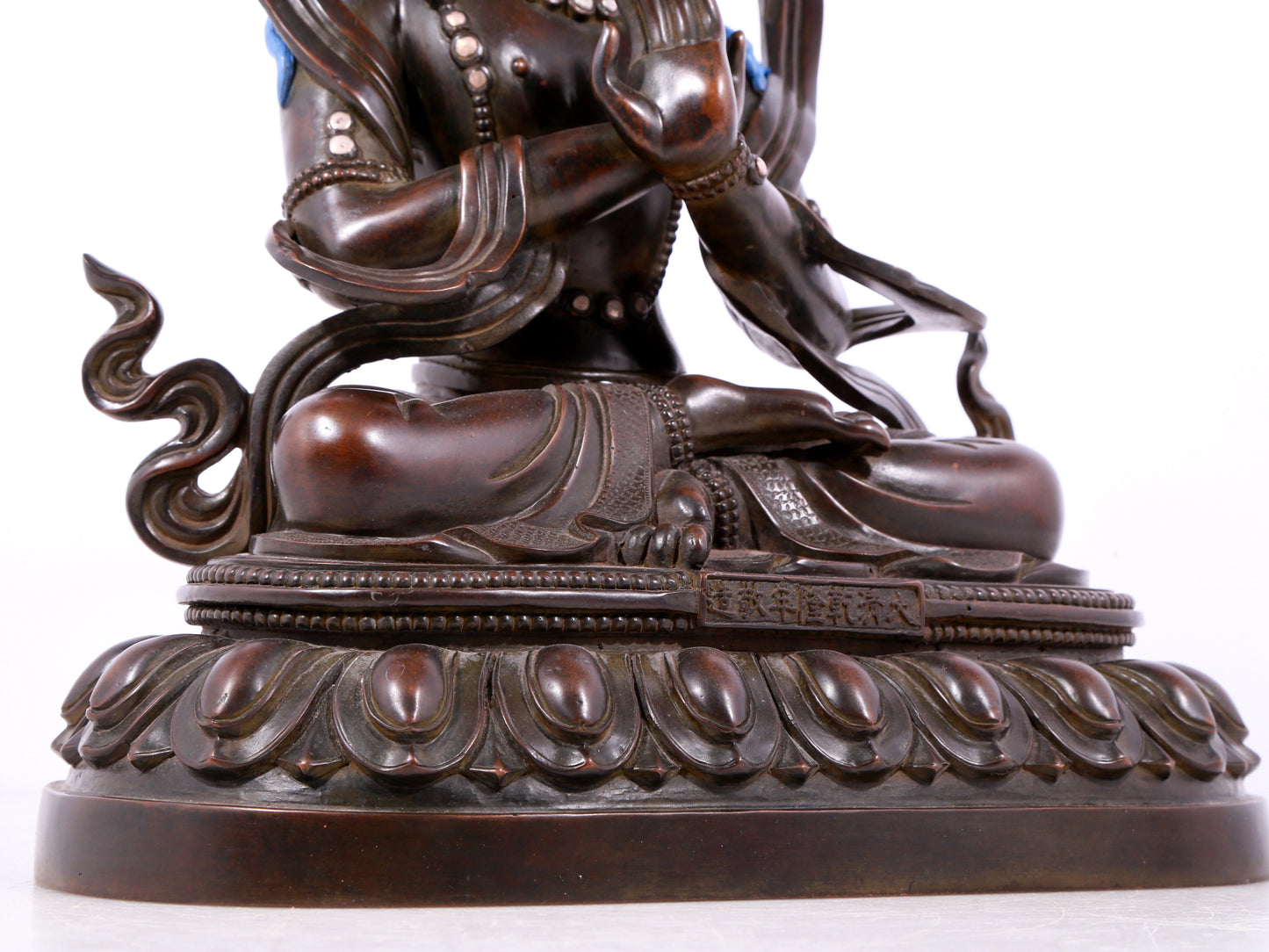 A solemn bronze Buddha statue