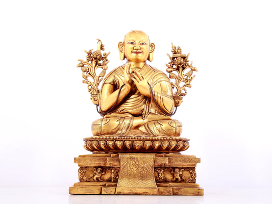 A solemn gilt bronze statue of guru