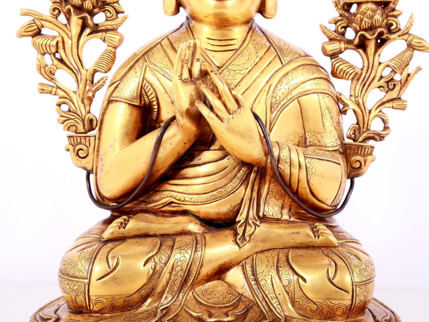 A solemn gilt bronze statue of guru