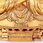 A solemn gilt bronze statue of guru