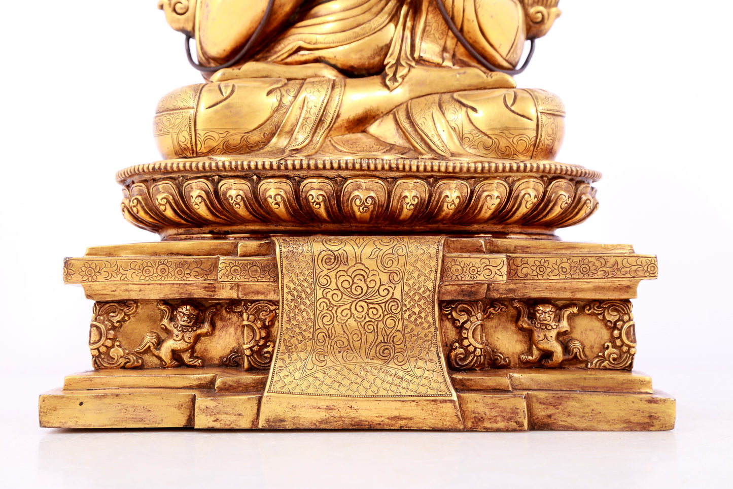 A solemn gilt bronze statue of guru