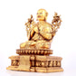 A solemn gilt bronze statue of guru