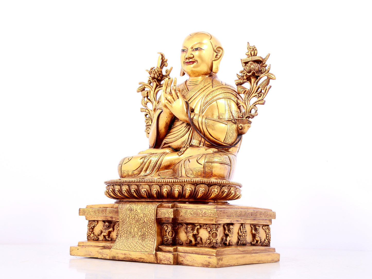 A solemn gilt bronze statue of guru