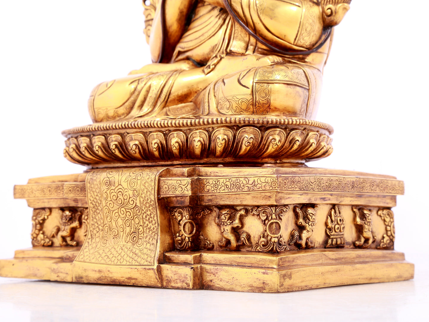 A solemn gilt bronze statue of guru